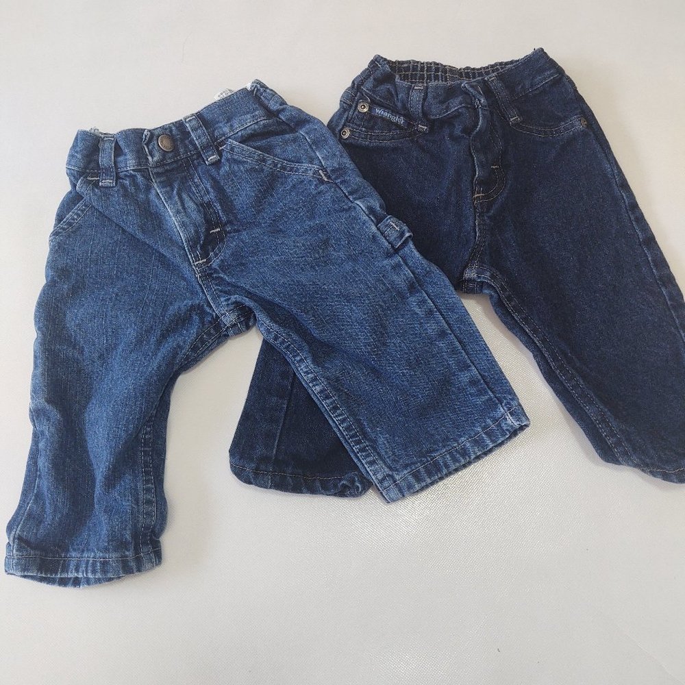 2 pairs of 12 month wrangler jeans